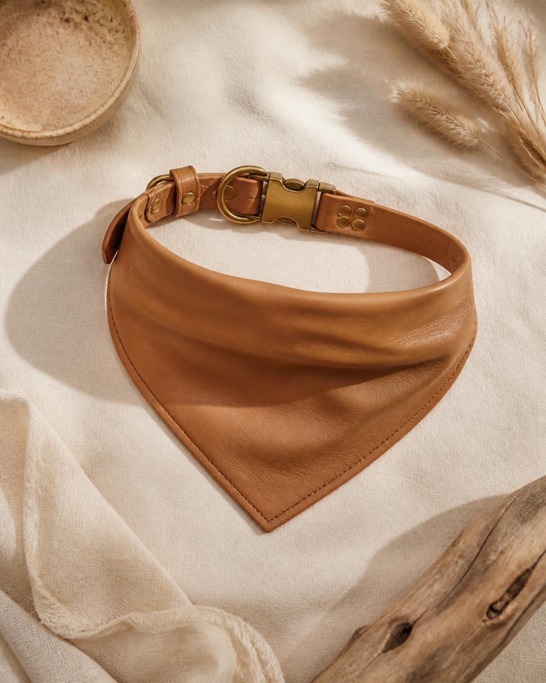 Camel leather dog bandana with brass hardware on bone linen